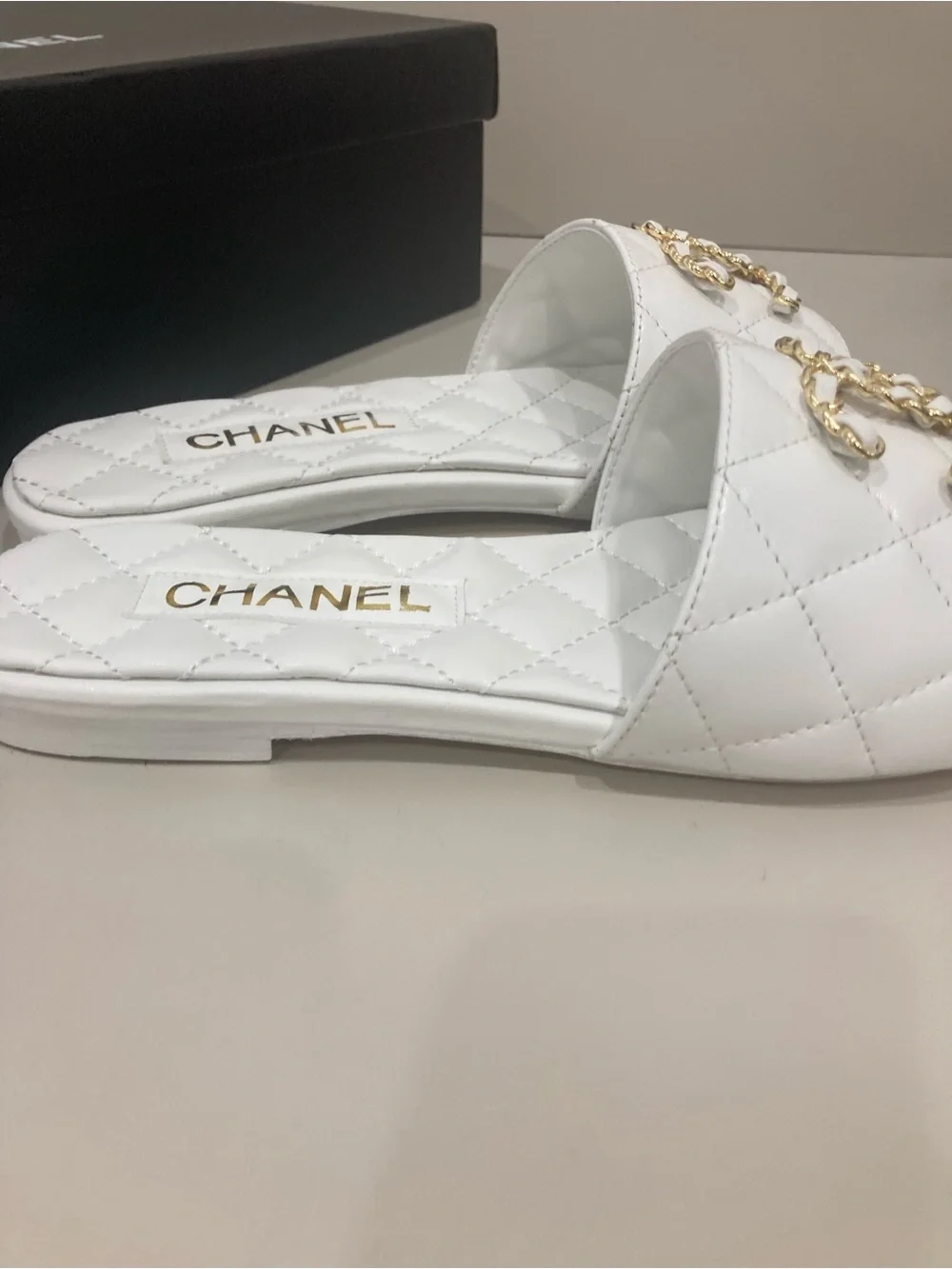 CHANEL White Quilted Slide Mules with Gold CC Chain Logo
